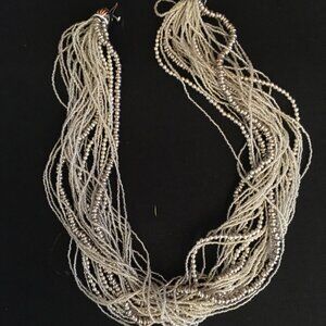 Gleaming Torsade Necklace, 28 Strands, Clear Glass and Silver Polymer Beads